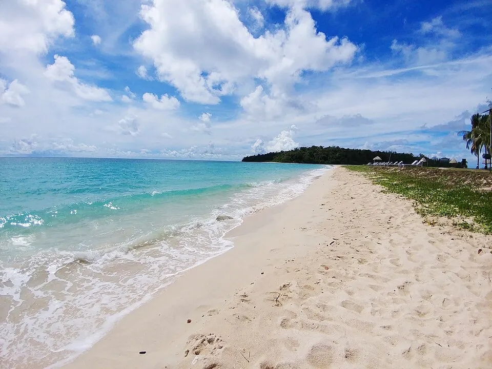 White-sand shore and turquoise water at Ross and Smith Islands near Diglipur